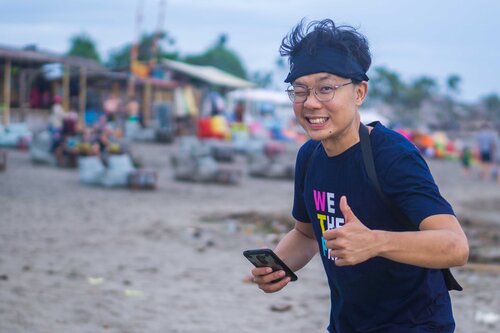 thumbs-up from a vegan activist with a phone